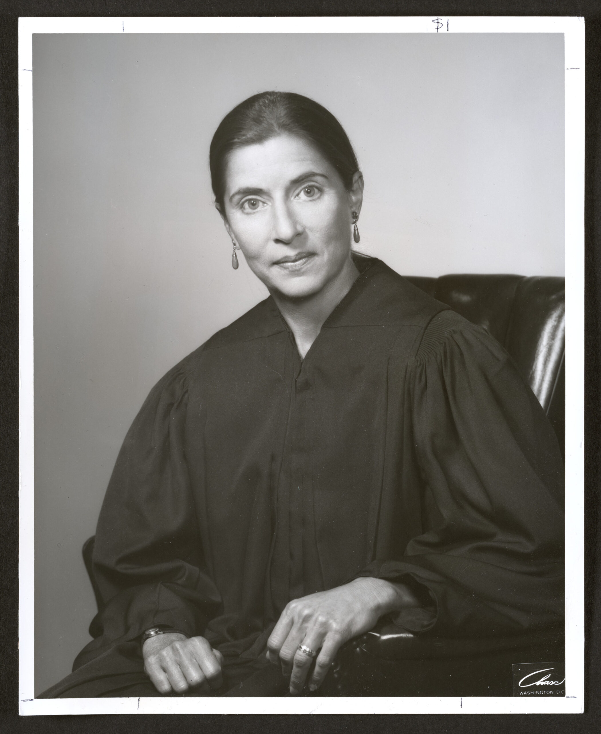 A black-and-white photo portrait of Justice Ruth Bader Ginsburg.